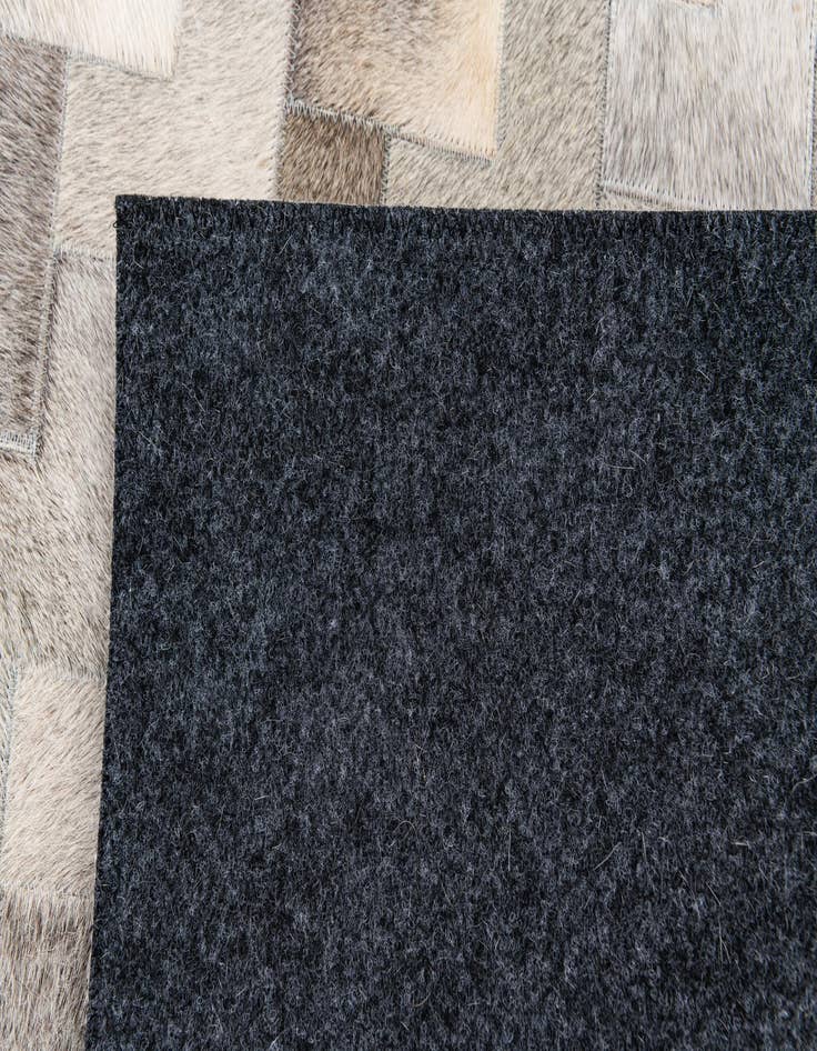 Detail image of 4' 1 x 5' 11 Cowhide Stocks Rug