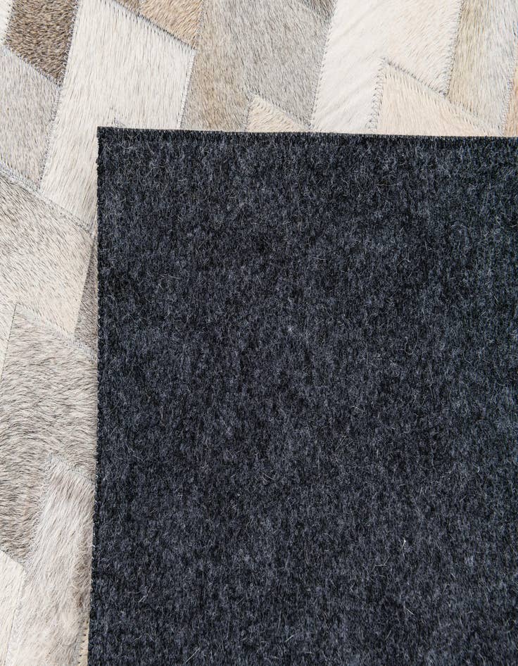 Detail image of 4' 1 x 5' 11 Cowhide Stocks Rug
