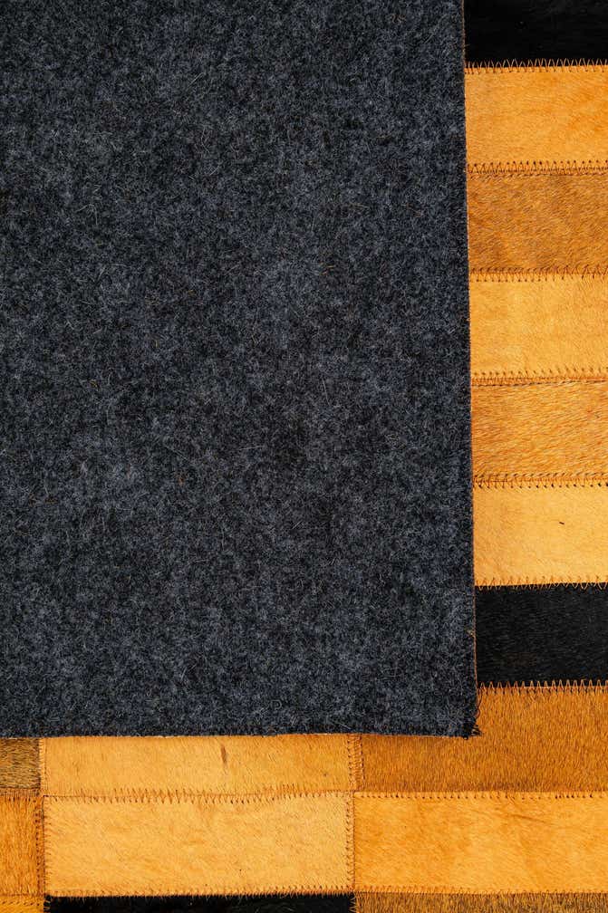 4' 11 x 8' 1 Cowhide - Patchwork Rug