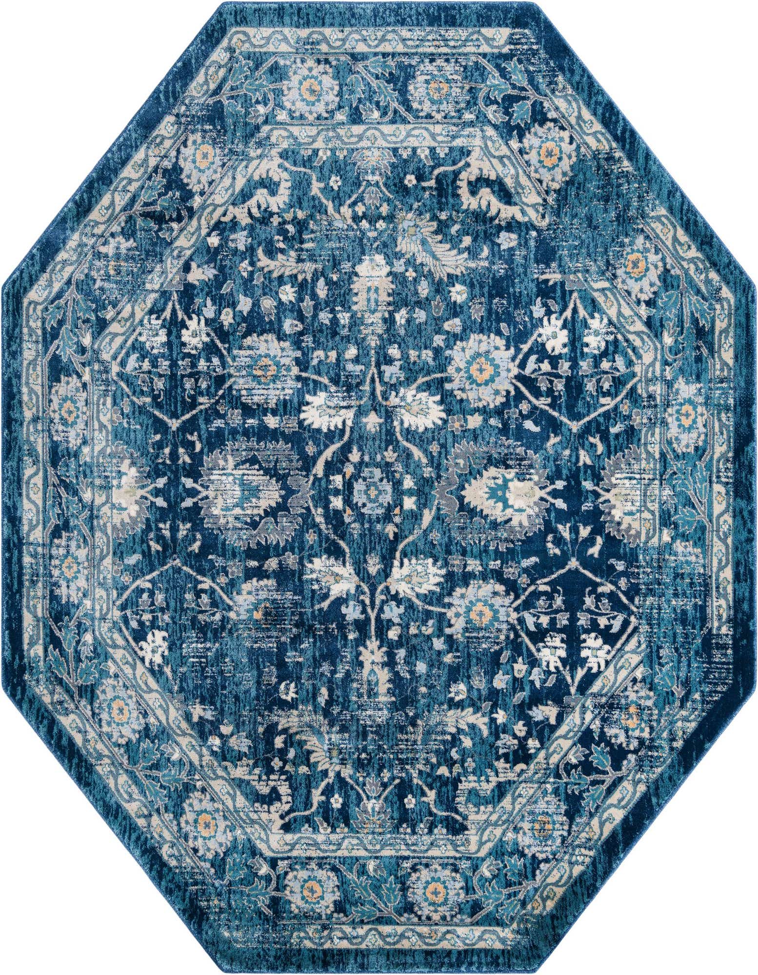 An octagon-shaped Dahlia Collection rug in shades of blue with a distressed traditional floral pattern and vintage look.