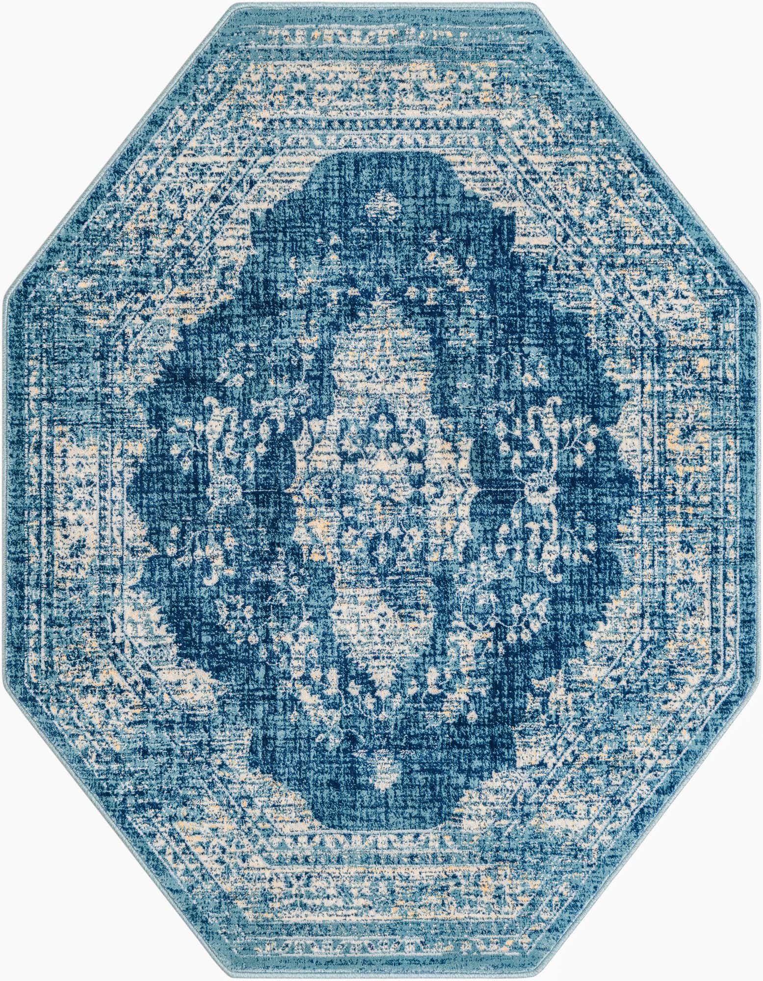 A 5' 3 x 5' 3 octagon Dahlia rug in varying shades of blue with a distressed traditional medallion pattern.