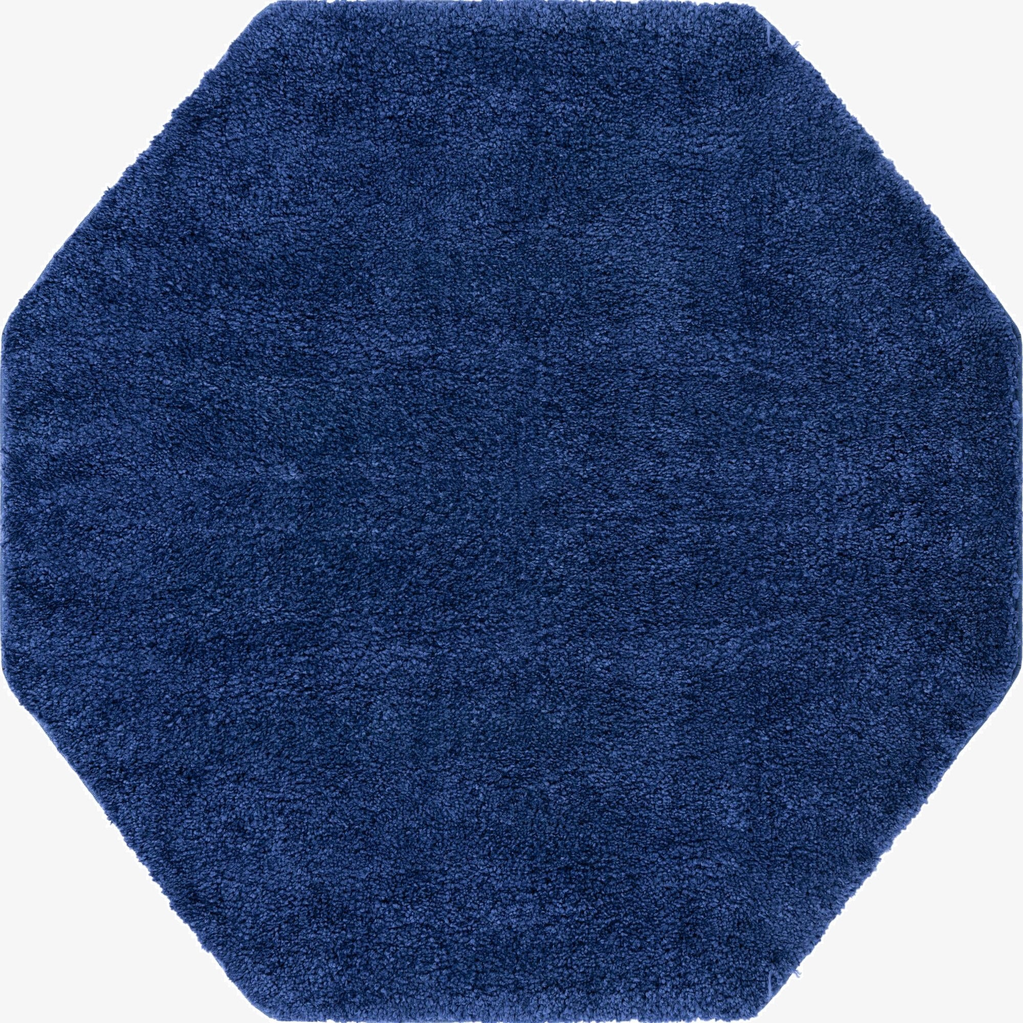 A 5' 0 x 5' 0 octagon navy blue textured rug, ideal for a modern or minimalist indoor space.
