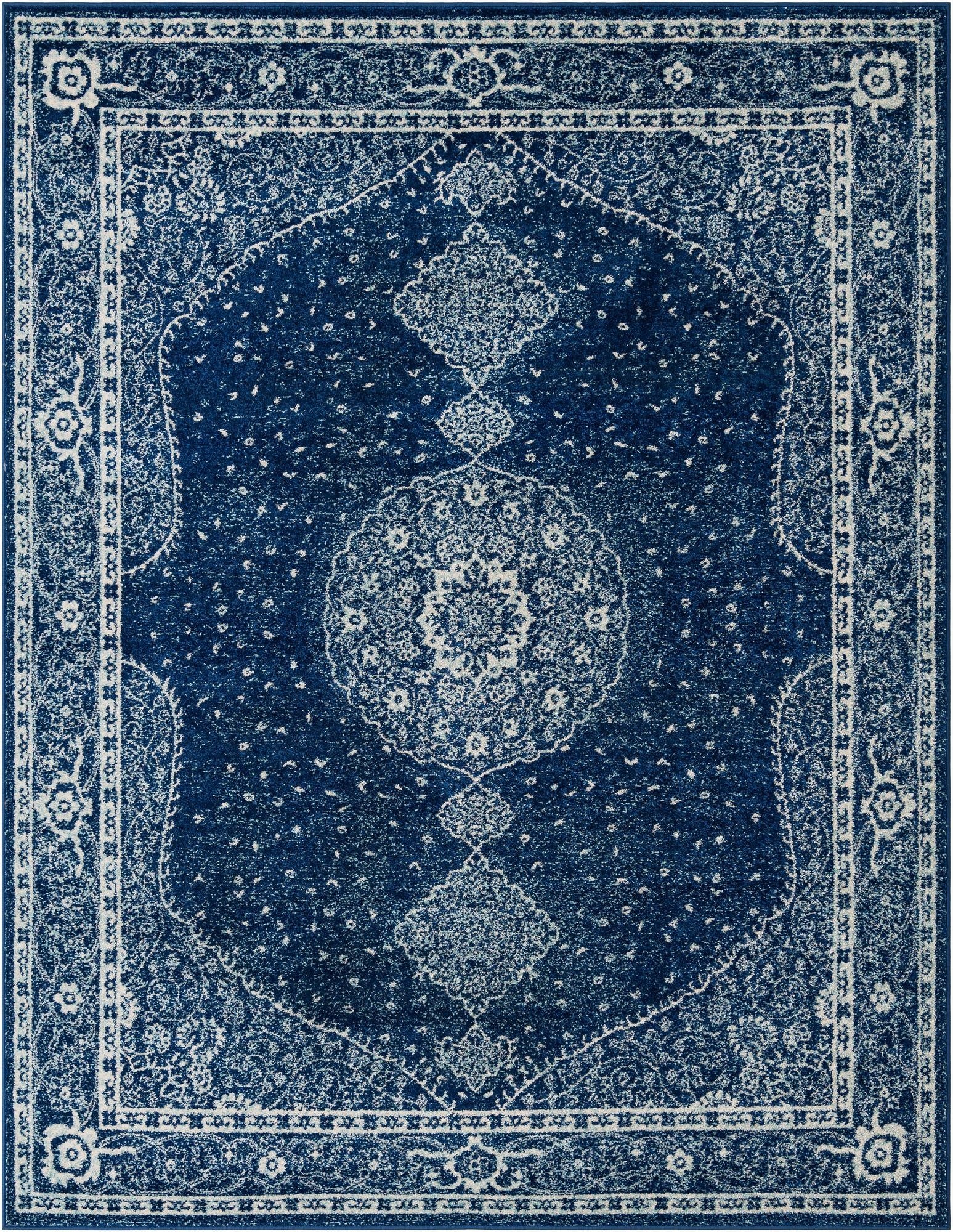 A rectangular 8x10 navy blue area rug with a distressed white medallion and traditional border pattern, suitable for a living room.