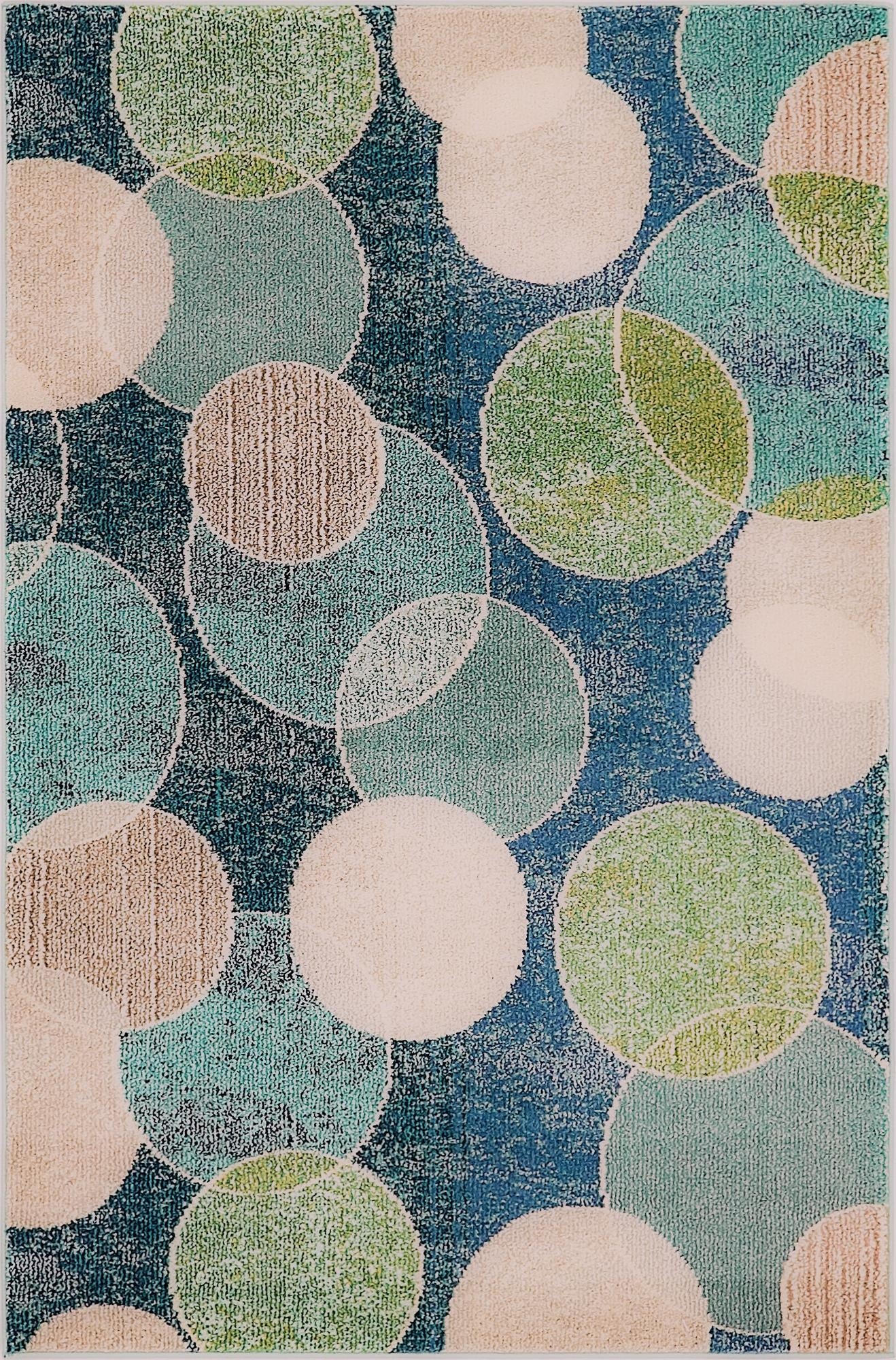 A 4x6 rectangular Theia rug featuring an abstract pattern of overlapping circles in shades of blue, green, and beige on a navy background.