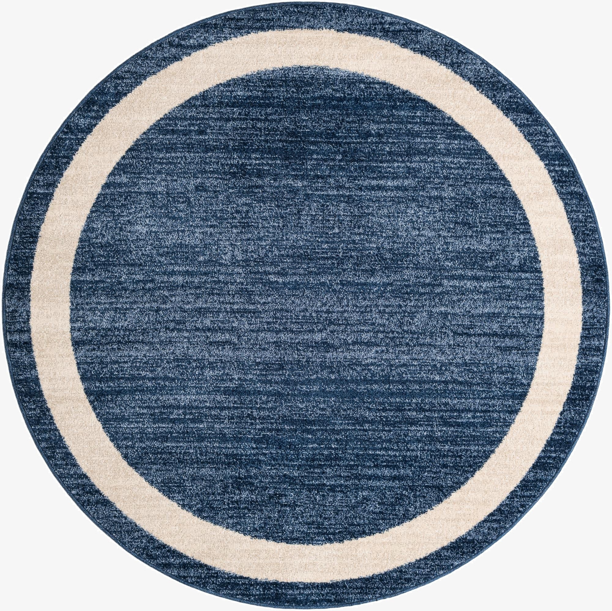 A 6' round navy blue rug with a cream border, featuring a textured, solid pattern, ideal for a contemporary indoor space.