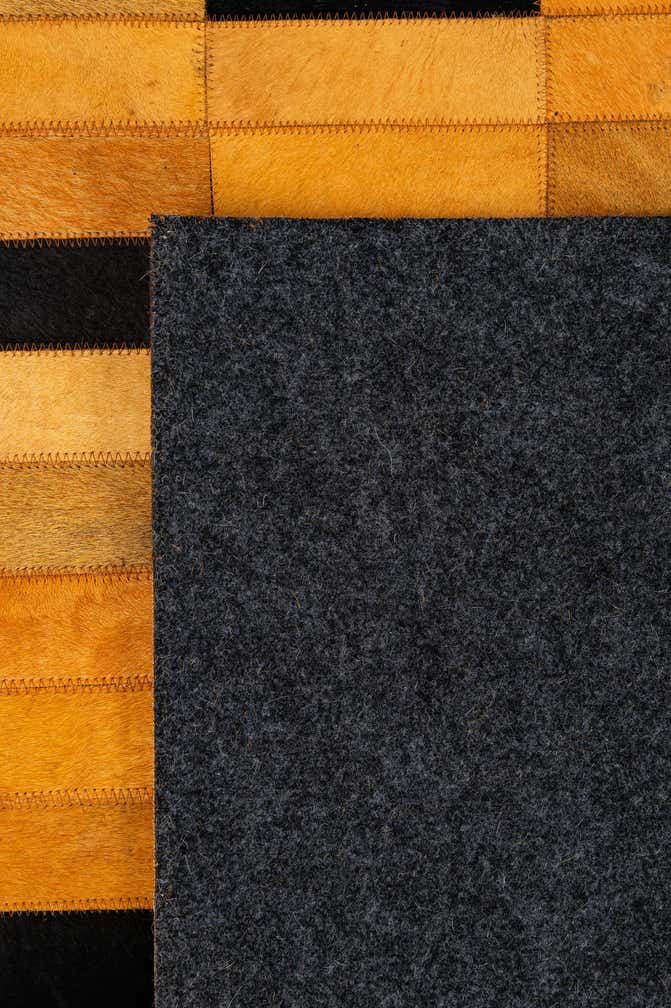4' 11 x 8' 1 Cowhide - Patchwork Rug