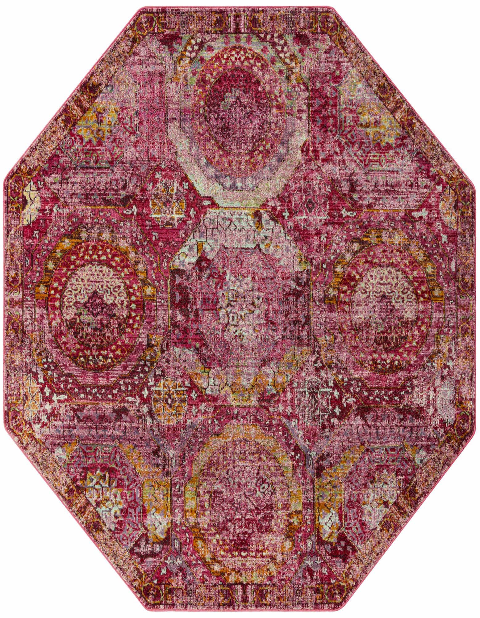 A 5' 3 x 5' 3 octagon rug in shades of pink, featuring a distressed transitional medallion pattern.