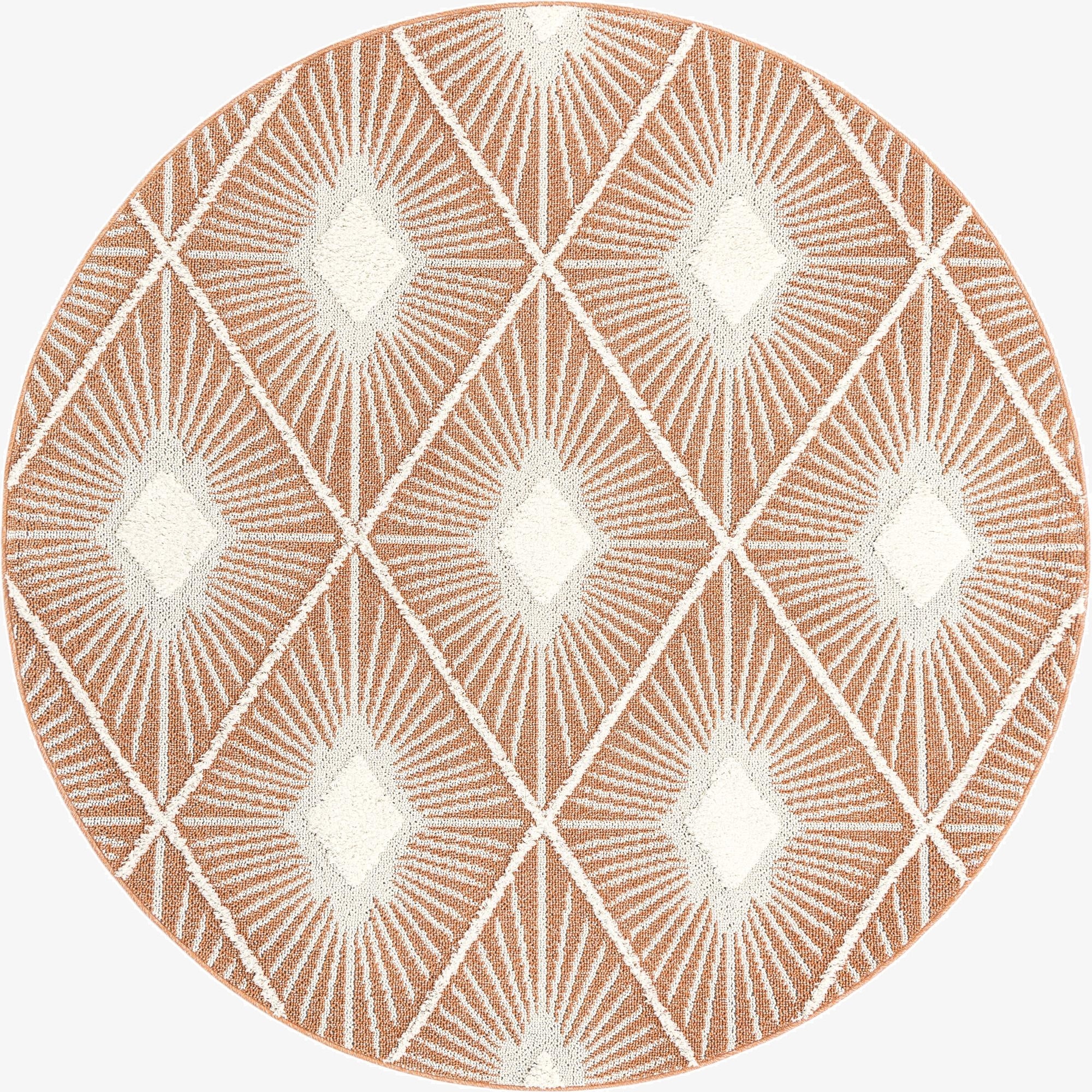 A round orange and white bohemian rug with a modern trellis pattern, featuring a textured pile.