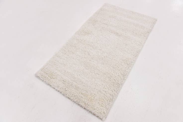 Detail image of 2' 8 x 4' 10 Luxe Solid Shag Rug