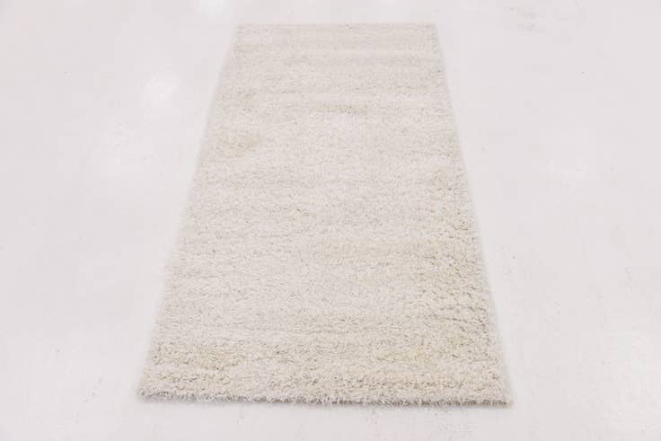 Detail image of 2' 8 x 4' 10 Luxe Solid Shag Rug