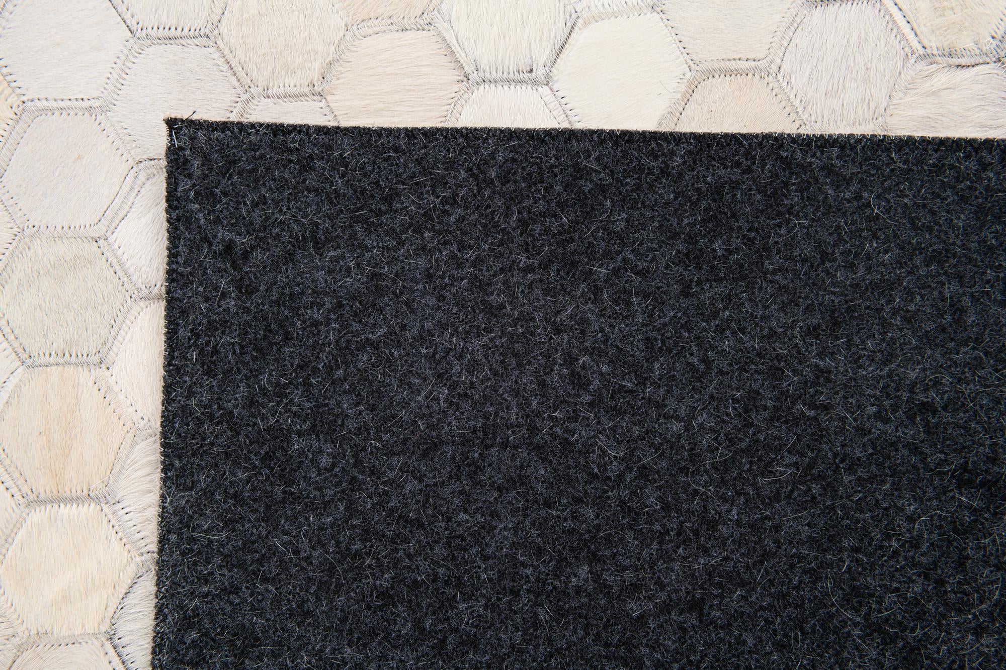 5' x 7' 8 Cowhide Stocks Rug
