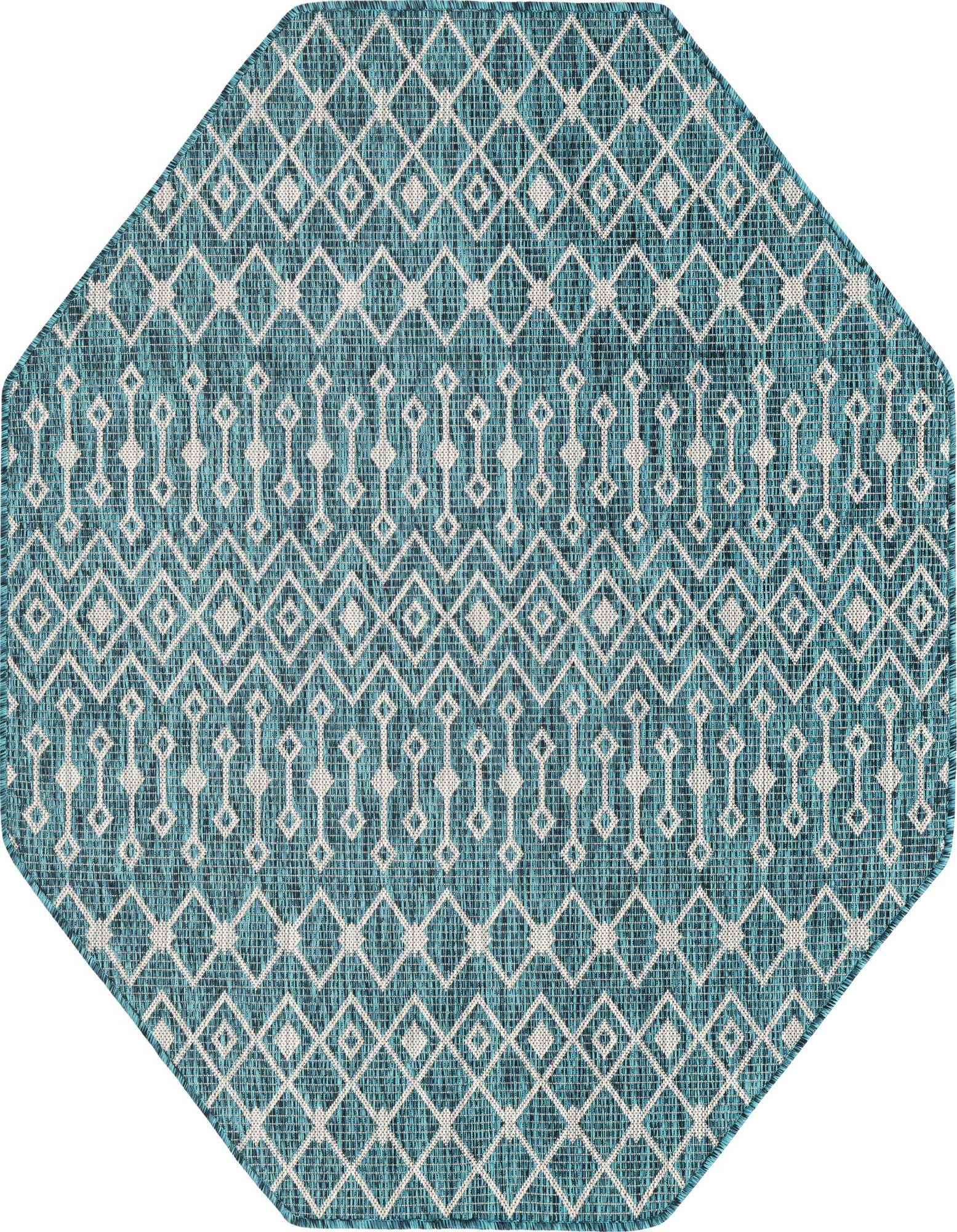 A 5' 3 x 5' 3 octagon blue and green tribal pattern rug, featuring white geometric diamonds and vertical motifs, suitable for indoor or outdoor use.