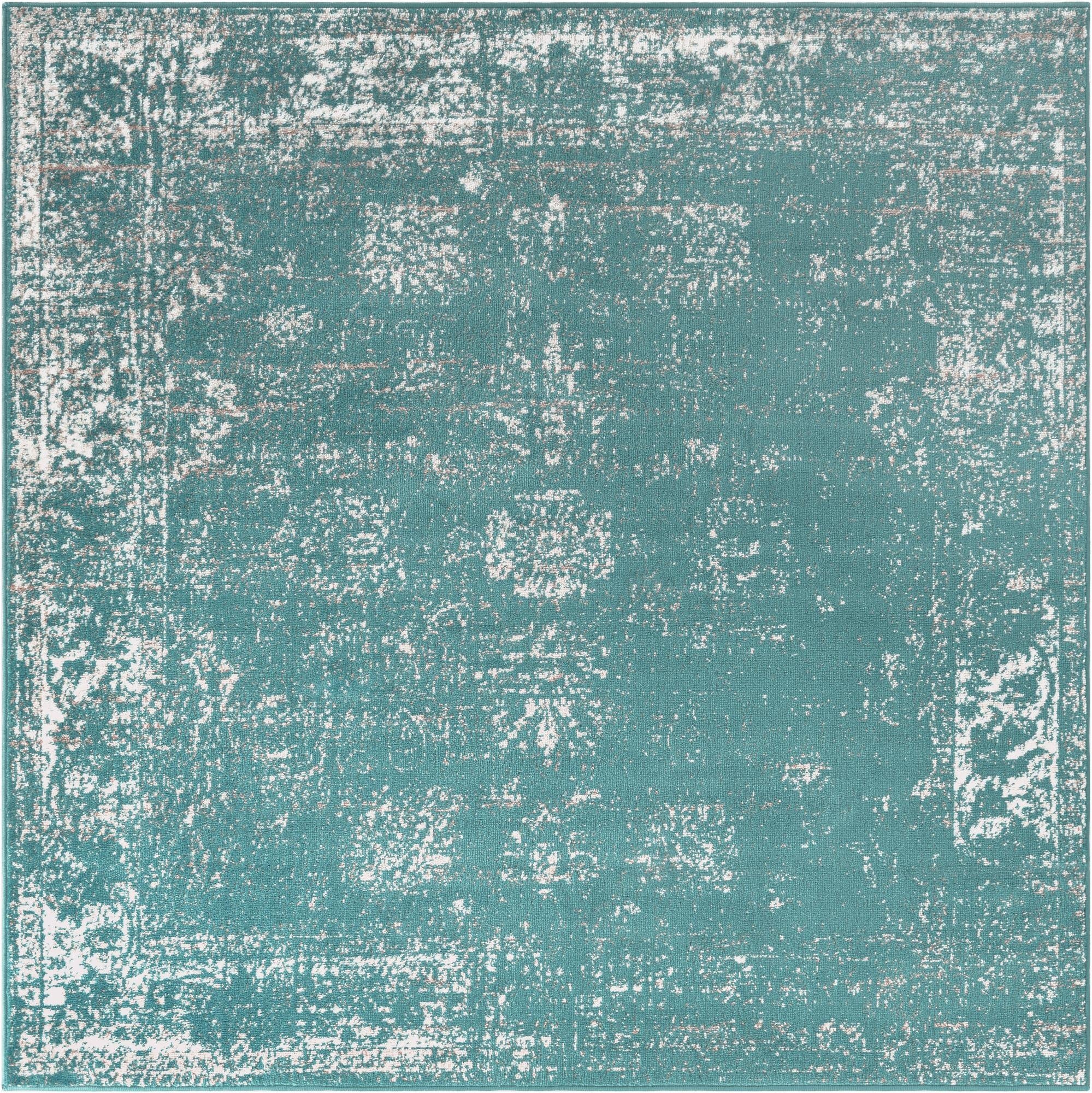A 6' 0 x 6' 0 square blue area rug with a distressed bohemian medallion pattern and white accents.